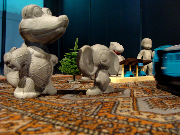 "The circle of the Past, Present and the Power". Installation: concrete, toys, carpet. 2010